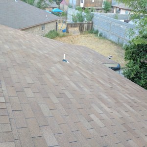 A view of a shingles roof after reroofing