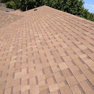 A view of a shingles roof after reroofing